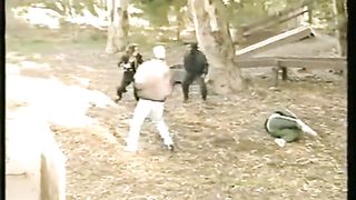 woman vs many man in the park