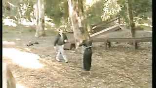 woman vs many man in the park