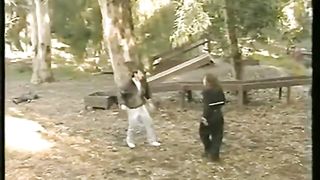 woman vs many man in the park