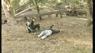 woman vs many man in the park