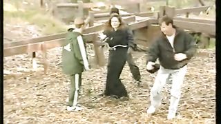 woman vs many man in the park