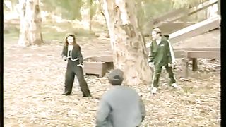 woman vs many man in the park