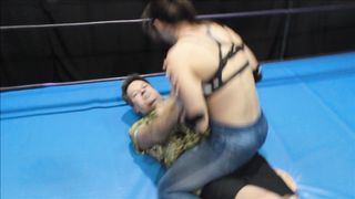 Muscular Adriana wrestling