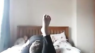 Girlfriend reverse headscissors her boyfriend in sexy leggings
