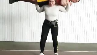 strong women lift guy overhead
