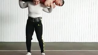 strong women lift guy overhead