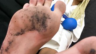 A slave licks the feet of a karate girl after training