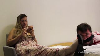 She hogties and gags him on the bed 35