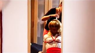 She has him tightly bound to a chair while doing his makeup 39