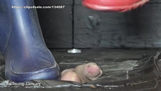 Extreme Ball Stomping and Trampling with abused red and blue rubber boots on cock board