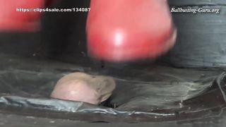 Extreme Ball Stomping and Trampling with abused red and blue rubber boots on cock board
