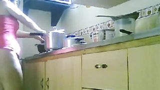 LATINA MATURE NUDE KITCHEN