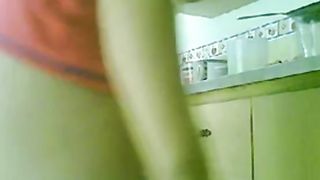 LATINA MATURE NUDE KITCHEN