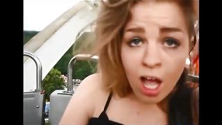 Cheerful beauty flashing in amusement park