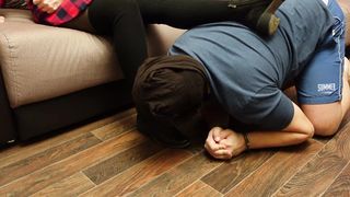 A Slave in Handcuffs and a Collar Licks the Shoes of a Mistress in Black Tights and Socks