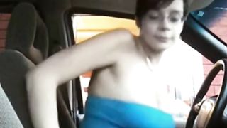 Woman showing her tits in a drive through