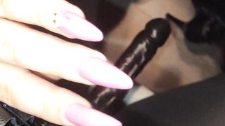 Teaser in Shiny leggings, overknee boots and a nice big strap-on ready to be used