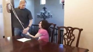Bound and tape gagged slut gets fucked on the table