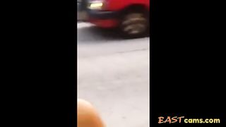 Asian woman stripped naked on street