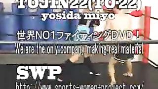 Asian girl boxes and kicks male opponent