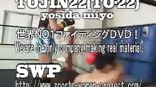 Asian girl boxes and kicks male opponent