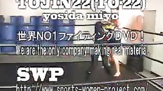 Asian girl boxes and kicks male opponent