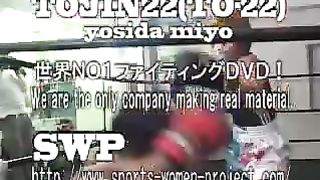 Asian girl boxes and kicks male opponent