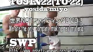 Asian girl boxes and kicks male opponent