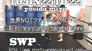 Asian girl boxes and kicks male opponent