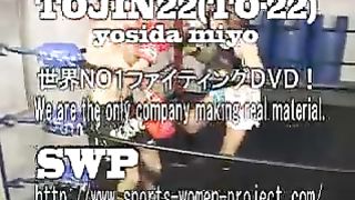 Asian girl boxes and kicks male opponent