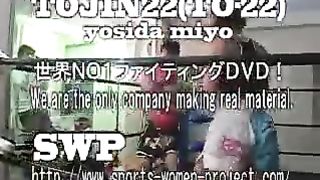 Asian girl boxes and kicks male opponent