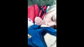 Blonde blowing cock outdoors