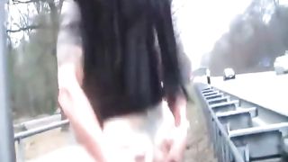 I saw two people banging next to the highway.