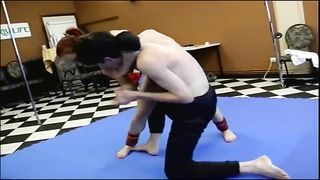 Muscular female beating up guy