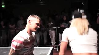 Women twerk on tied men