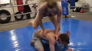 Aggressive woman in real mixed wrestling