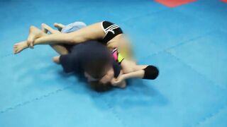 Strong nice fitness girl vs man headscissor wrestling