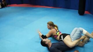Strong nice fitness girl vs man headscissor wrestling