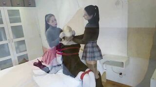 Two Girls Skillfully Tie Up A Male.