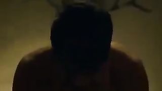 White dominatrix dominating Indian man on bed