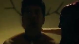 White dominatrix dominating Indian man on bed