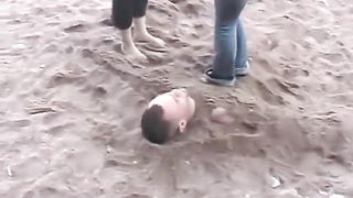 Beach buried foot licking