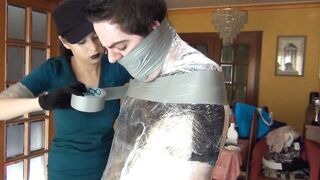 The girls bust in and bind him