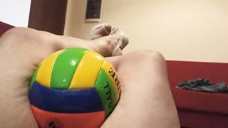 Crush volleyball between her things easily